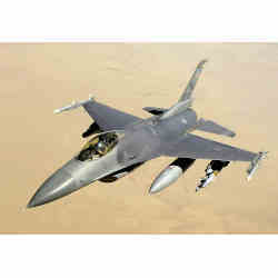 A U.S. Air Force F-16 fighter jet flying over desert.