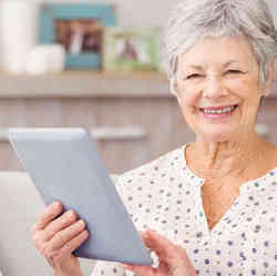 A senior using a tablet computer.