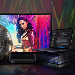 Wonder Woman on computer display, books and laptop in foreground