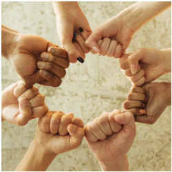 circle of fists showing solidarity