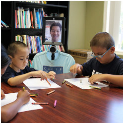 student on telepresence robot with classmates