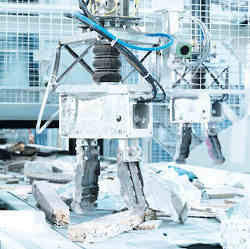 Recycling robots separating different types of discarded materials.