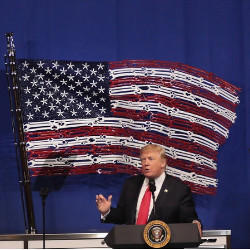 President Trump in front of American flag