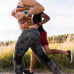 Runners wearing smartwatches. 