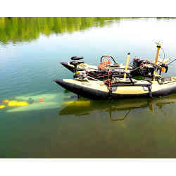 An AUV (left, under water) connects with a mobile docking station. 