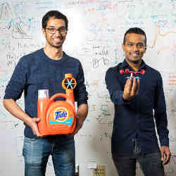 Two members of the University of Washington team show off some 3D-printed Internet of Plastic Things things.