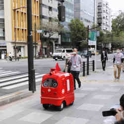 The DeliRo robot making a delivery in Tokyo.