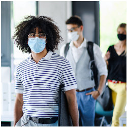 masked employees entering an workplace