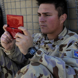 soldier with handheld gaming console