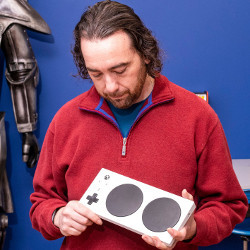 AbleGamers founder Mark Barlet holds modified video game controller