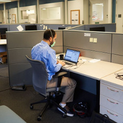 Advanced Silicon Group worker at desk