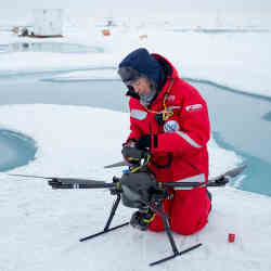 Roberta Pirazzini prepares a drone for flight over the Arctic.