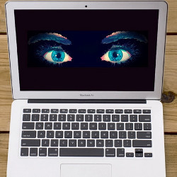 laptop computer with watching eyes