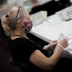 A poll worker during the ballot count.