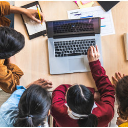 students at laptop computer