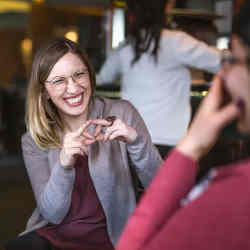 Many Deaf people use sign language to communicate.