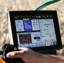 A yield monitor in a Deere & Co. combine, in use while harvesting corn at a farm in Union Springs, NY.