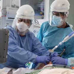 Doctors intubate a Covid patient. 