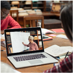 student viewing online lecture on laptop computer