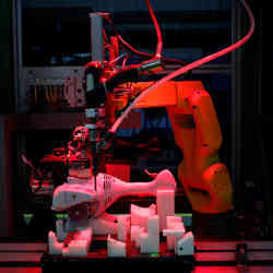 A robot assembles a power tool in a factory in Virginia Beach, VA.