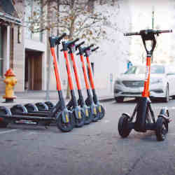 Spin e-scooters ready to ride, or to be recalled remotely.