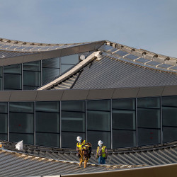 construction workers on roof of Google building