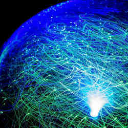 Illustration of fiber-optic cables carrying data to and from the Internet.