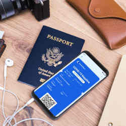 An actual U.S. passport (left) and the CommonPass app, which was designed to look like a boarding pass.