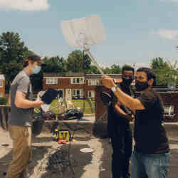 Adam Bouhmad, second from right, has helped low-income families in Baltimore get affordable Internet service through his Waves project.