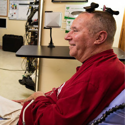 man with two wireless brain-computer interface transmitters on his head