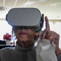 A nursing-home resident in Falls Church, VA, experiences virtual-reality nature scenes.