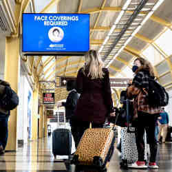 Travelers in February at Ronald Reagan National Airport near Washington.