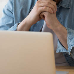 careful reader at laptop computer