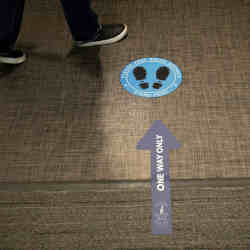 Social distancing signs have been placed on the floor at Cushman & Wakefields offices in Chicago. 
