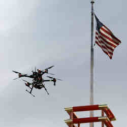 An aerial drone flies over downtown Reno, NV, during a NASA demonstration of its Unmanned Aircraft Systems Traffic Management platform.