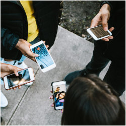 group of people holding cellphones