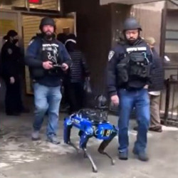 robot dog with New York Police Department officers