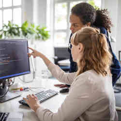 Women studying computer science. 