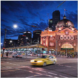 cars moving past Flinders Street Station in Melbourne 