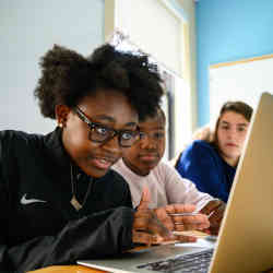 Girls working on a computer science project for Girls Who Code.