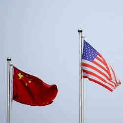 The flags of China (left) and the United States.