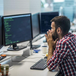 programmer at computer screen