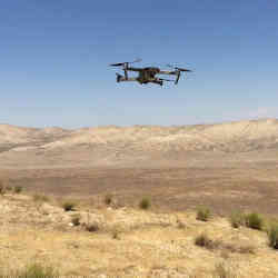 A hovering drone searches for space rocks.