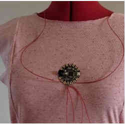 A garment sewn with conductive yarn, with seams connected by wire to a microcontroller.