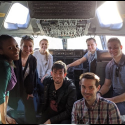 research team on the flight deck of a C-17 aircraft