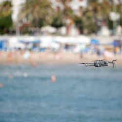 A drone monitors beach crowds. 