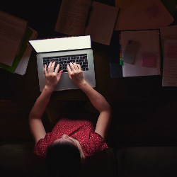 lone worker at laptop computer