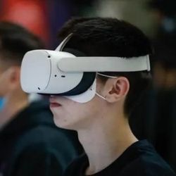 Young person looks through virtual reality goggles