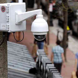 A surveillance camera attached to a light pole along Boylston Street in Boston.