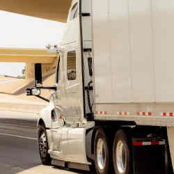 A TuSimple truck equipped with the company's autonomous driving system drives on Interstate Highway 10 in Tucson, AZ.